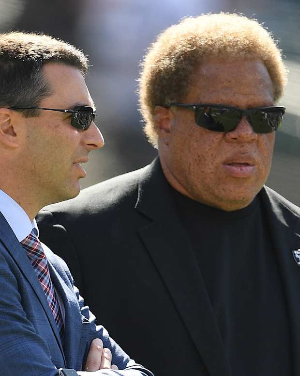 Tom Telesco and Reggie McKenzie